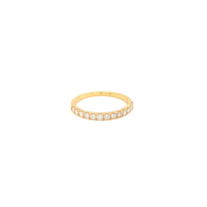 Gold eternity ring with embedded diamonds on a white background