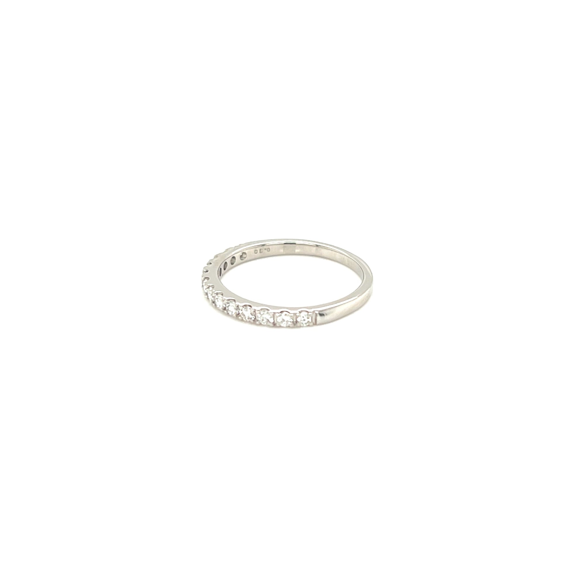Eternity ring with small diamonds on a white background