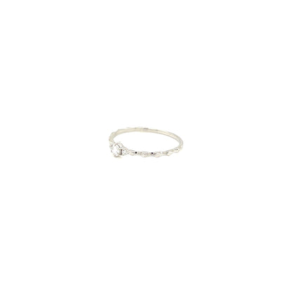 platinum ring with a small diamond on a white background
