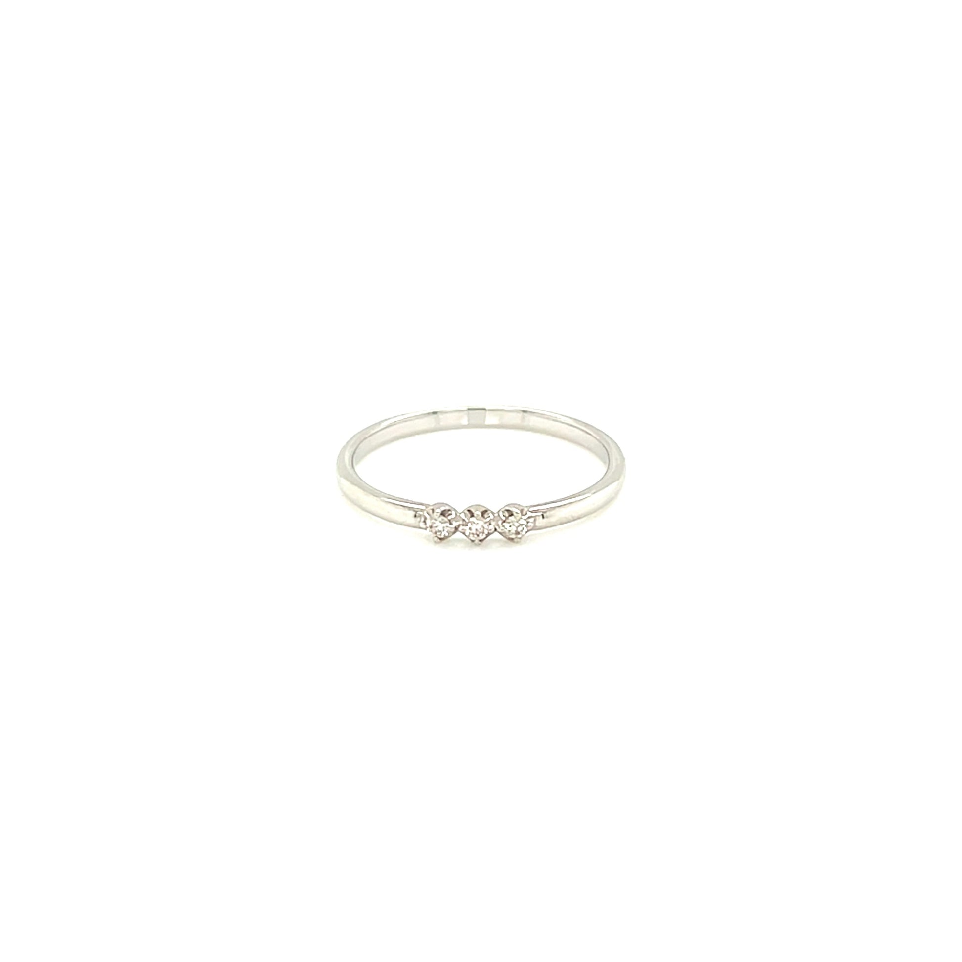White gold ring with a small diamond on a white background