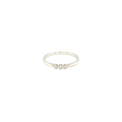 White gold ring with a small diamond on a white background