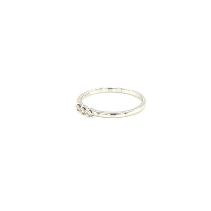 Silver ring with a small design on a white background