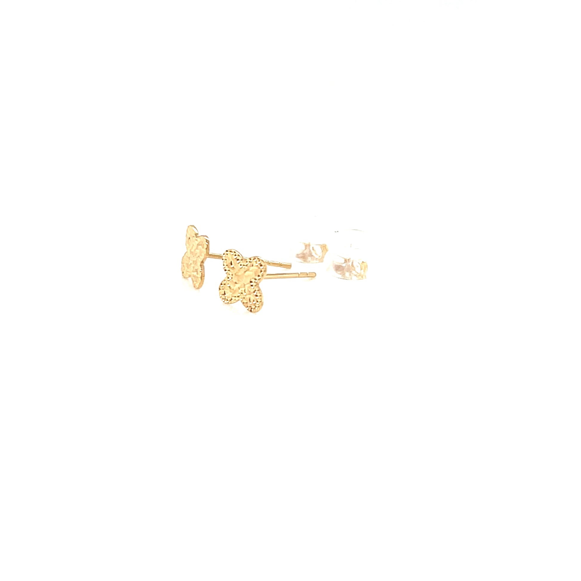 Gold clover-shaped earrings on a white background
