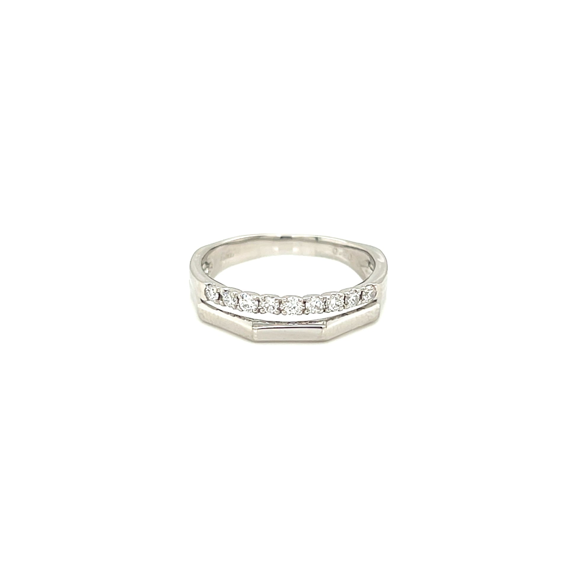 platinum ring with small diamonds on a white background