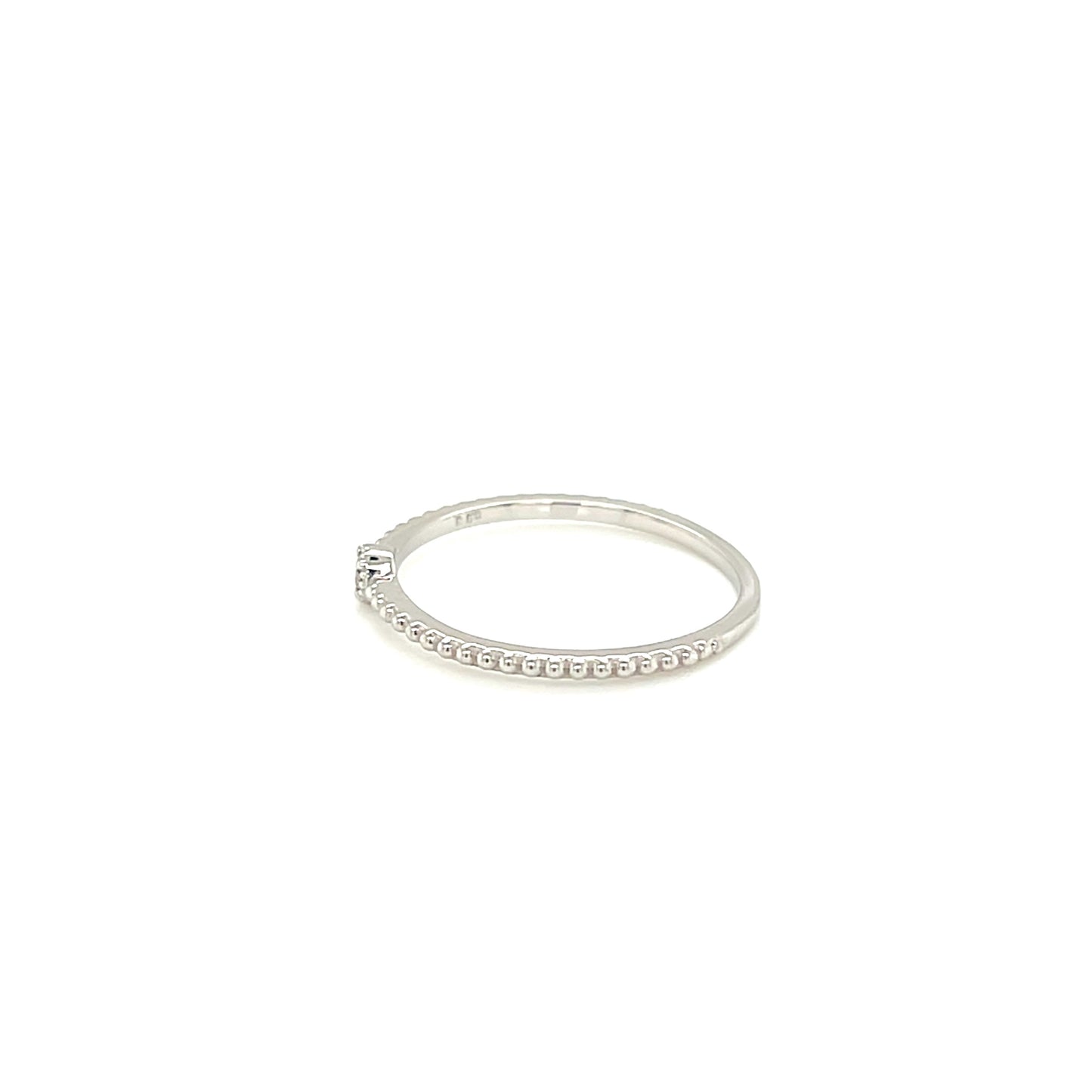 White gold ring with small stones on a white background