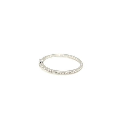 White gold ring with small stones on a white background