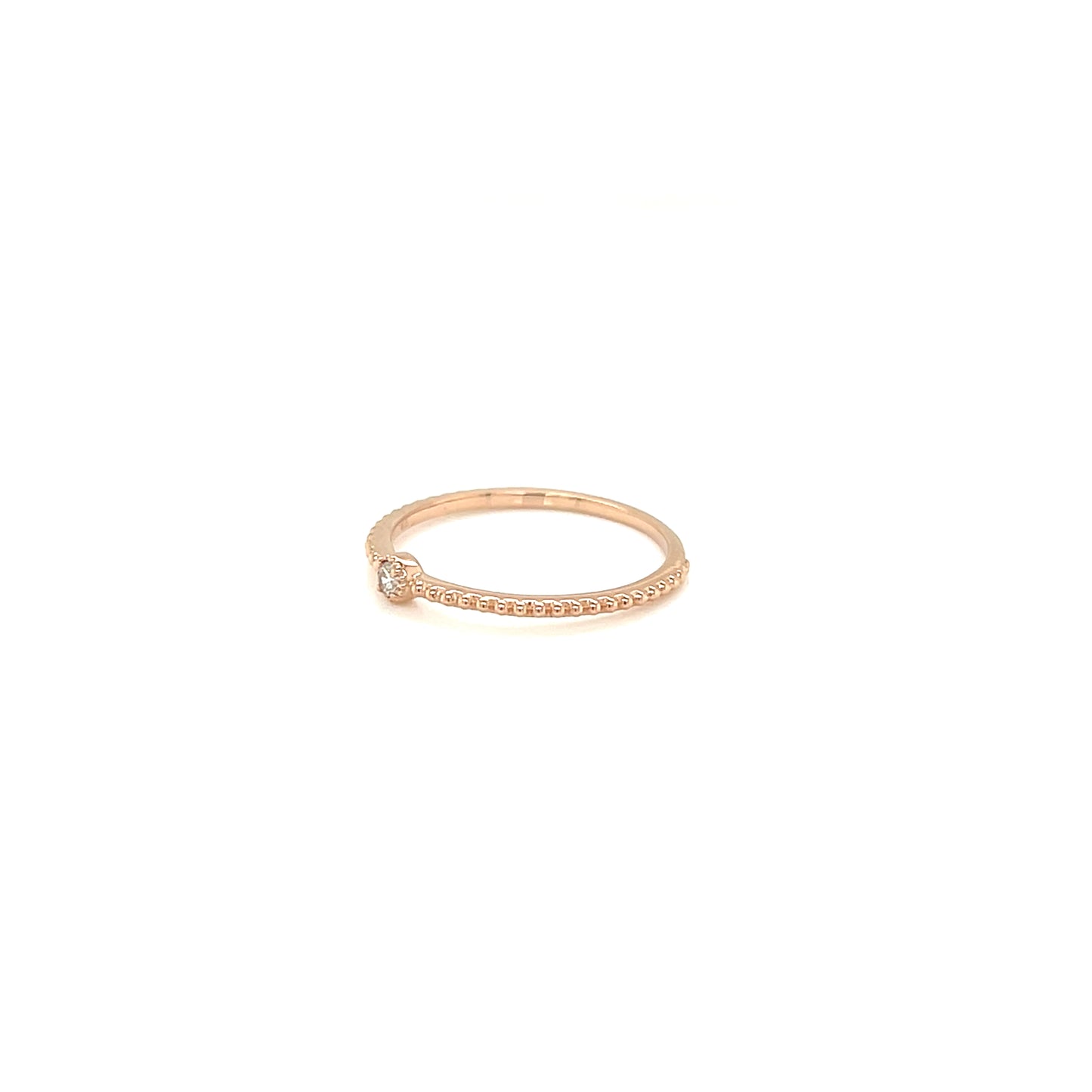 Rose gold ring with small diamonds on a white background