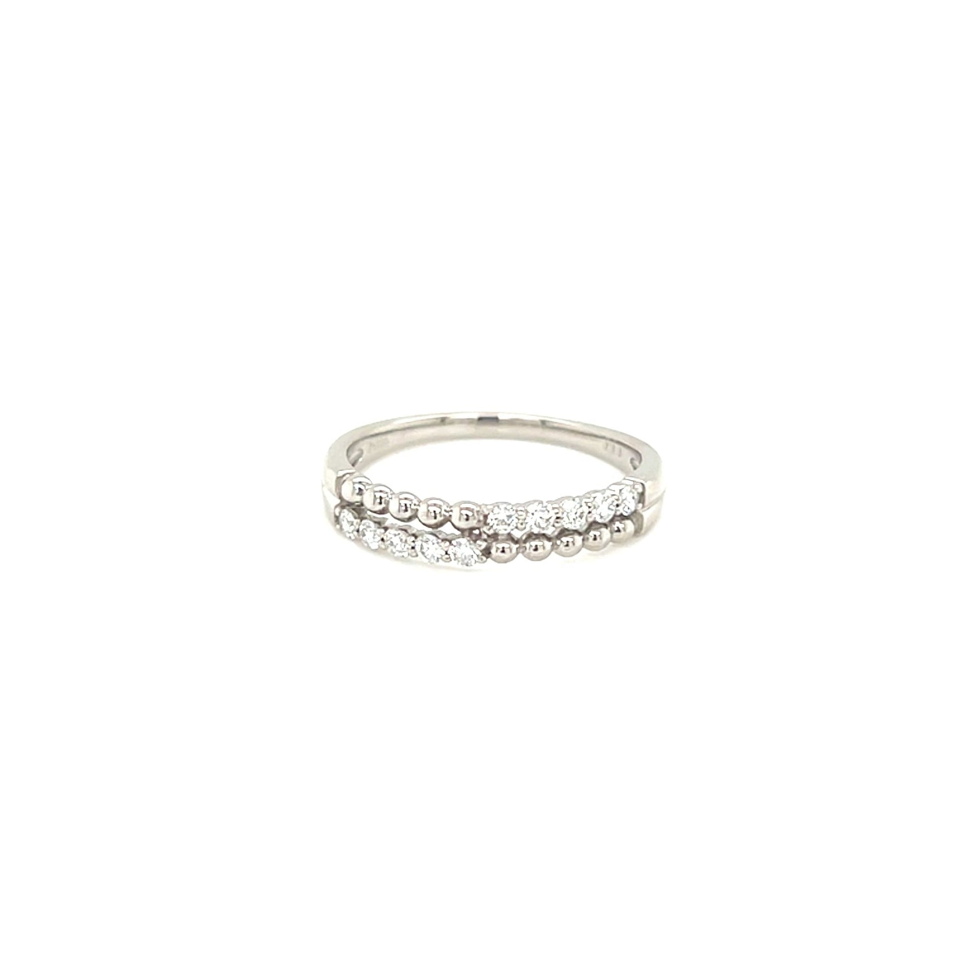 White gold ring with small stones on a white background