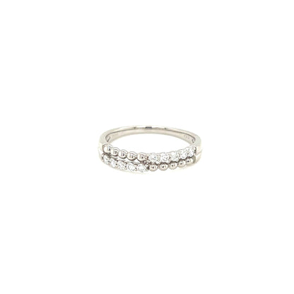 White gold ring with small stones on a white background