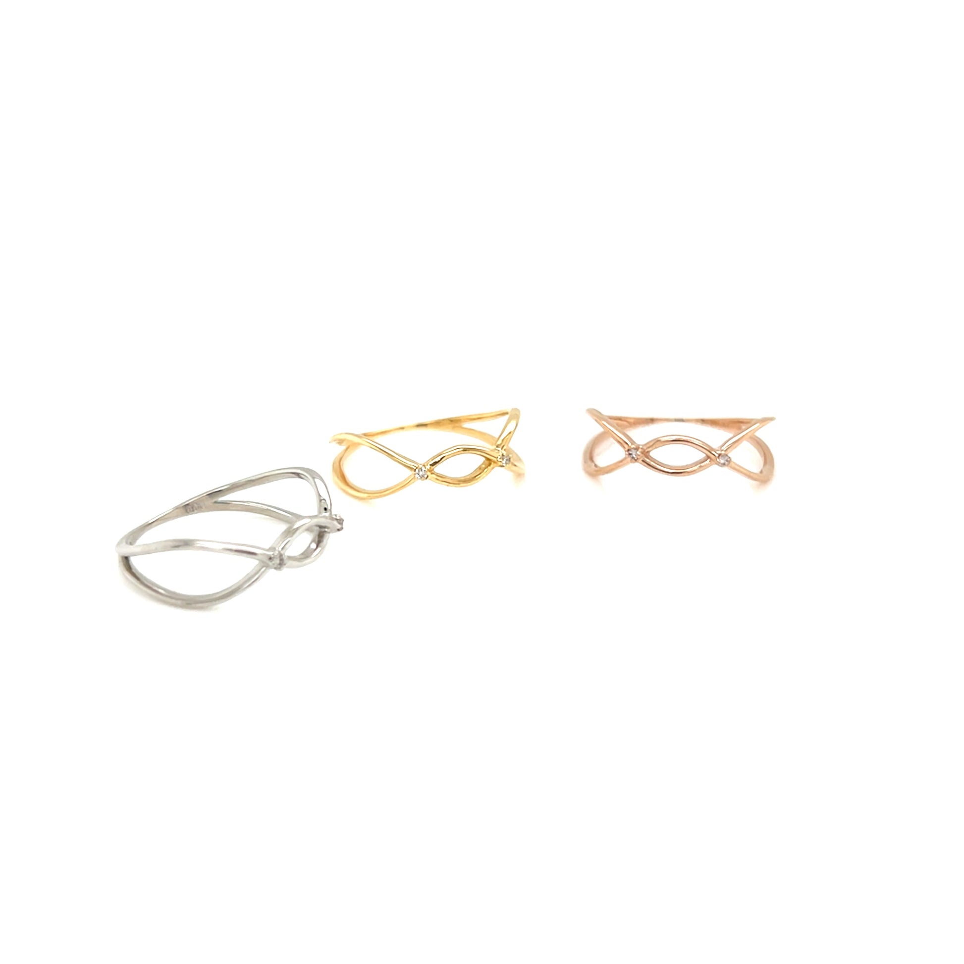 3 rings in fine line in gold, silver, and rose gold on a white background.