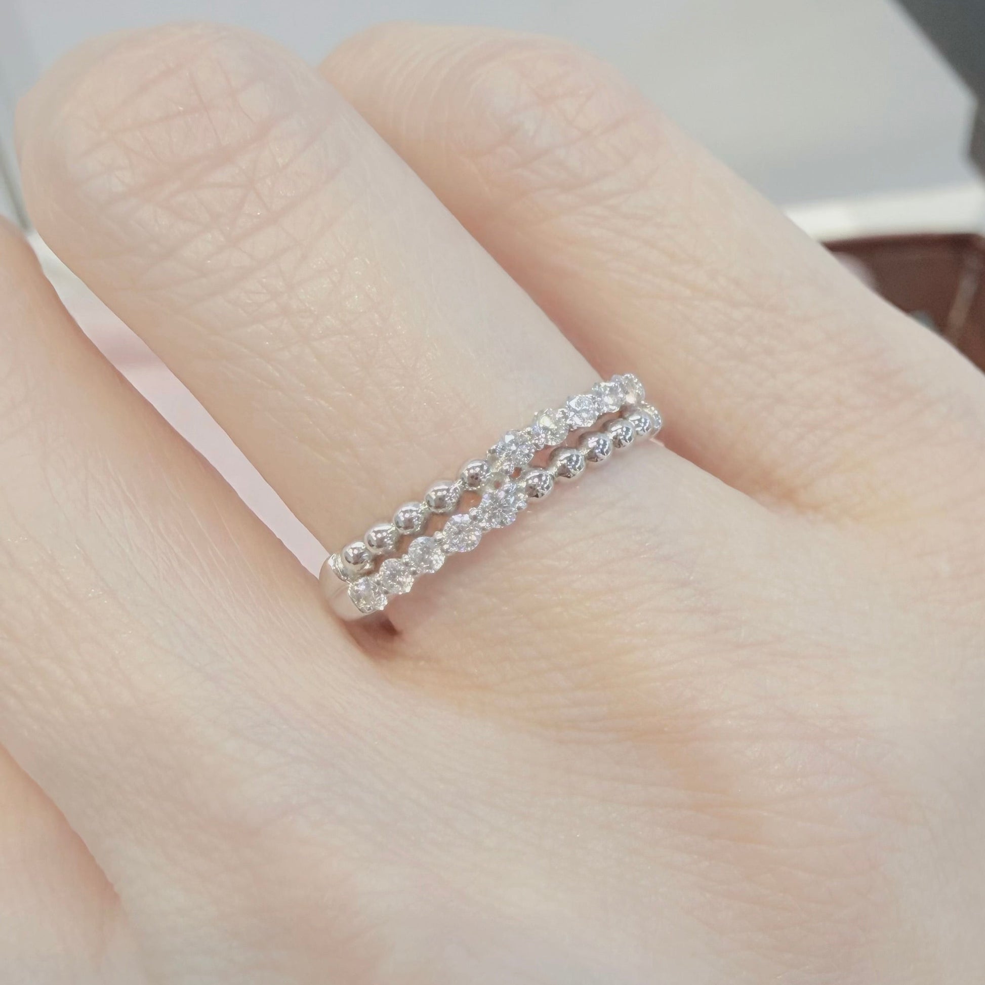 diamond ring on a finger