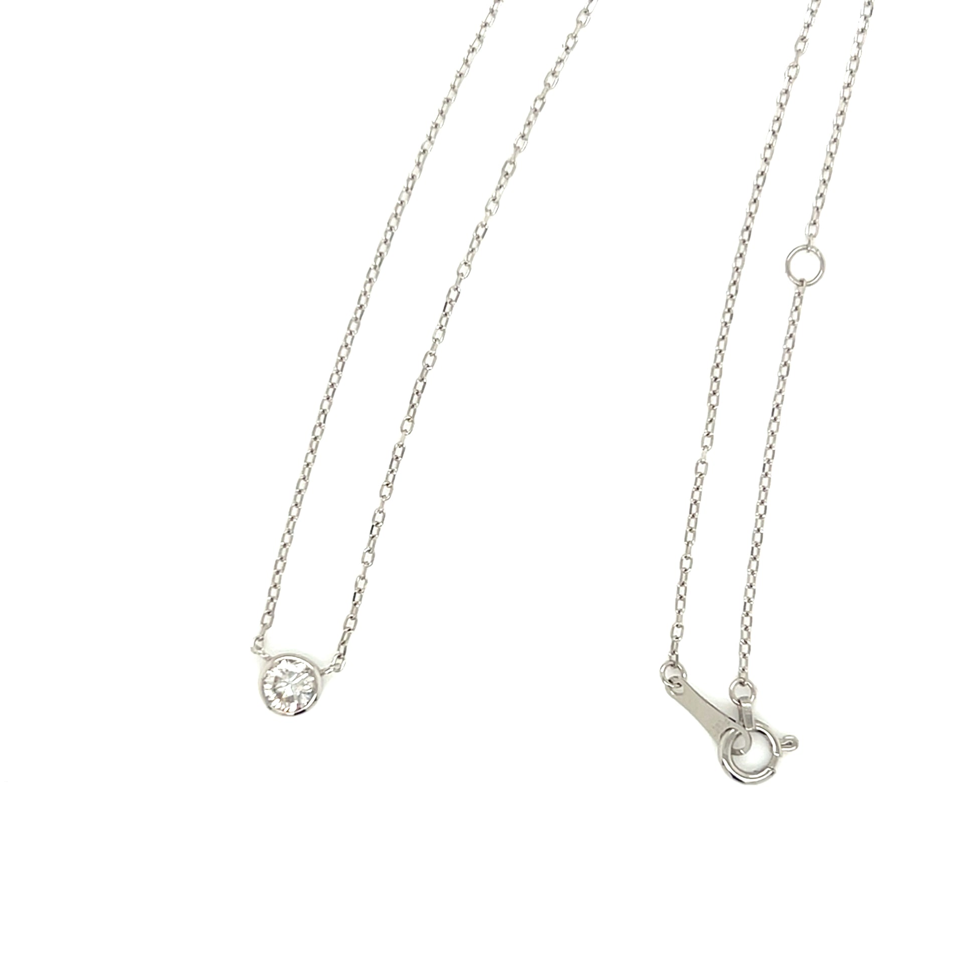 Platinum necklace with a round diamond pendant on a white background