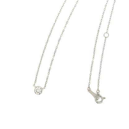 Platinum necklace with a round diamond pendant on a white background