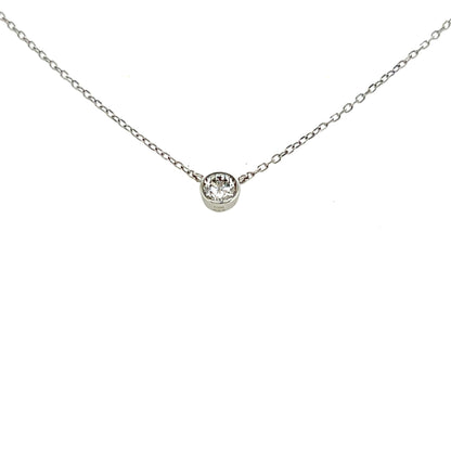 Platinum necklace with a round pendant on a white background