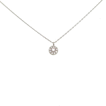 A delicate silver chain necklace with a small circular pendant set with clear stones, displayed against a solid white background.