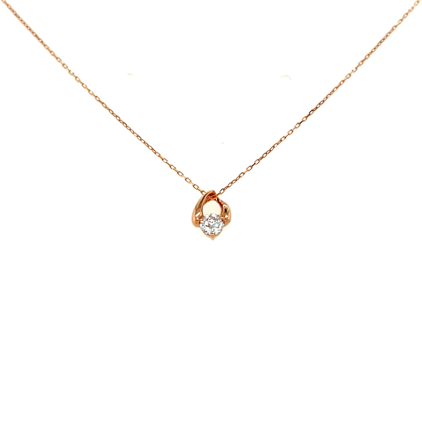 Rose gold necklace with a small pendant on a white background