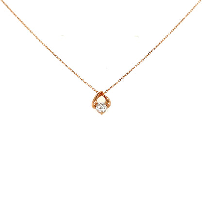 Rose gold necklace with a small pendant on a white background
