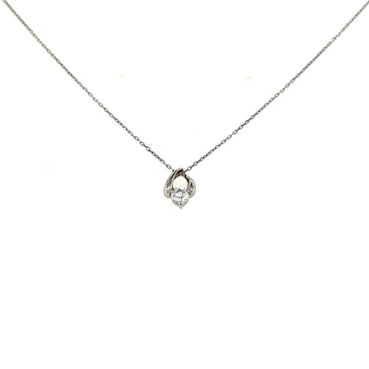 platinum necklace with a waterdrop shaped pendant on a white background