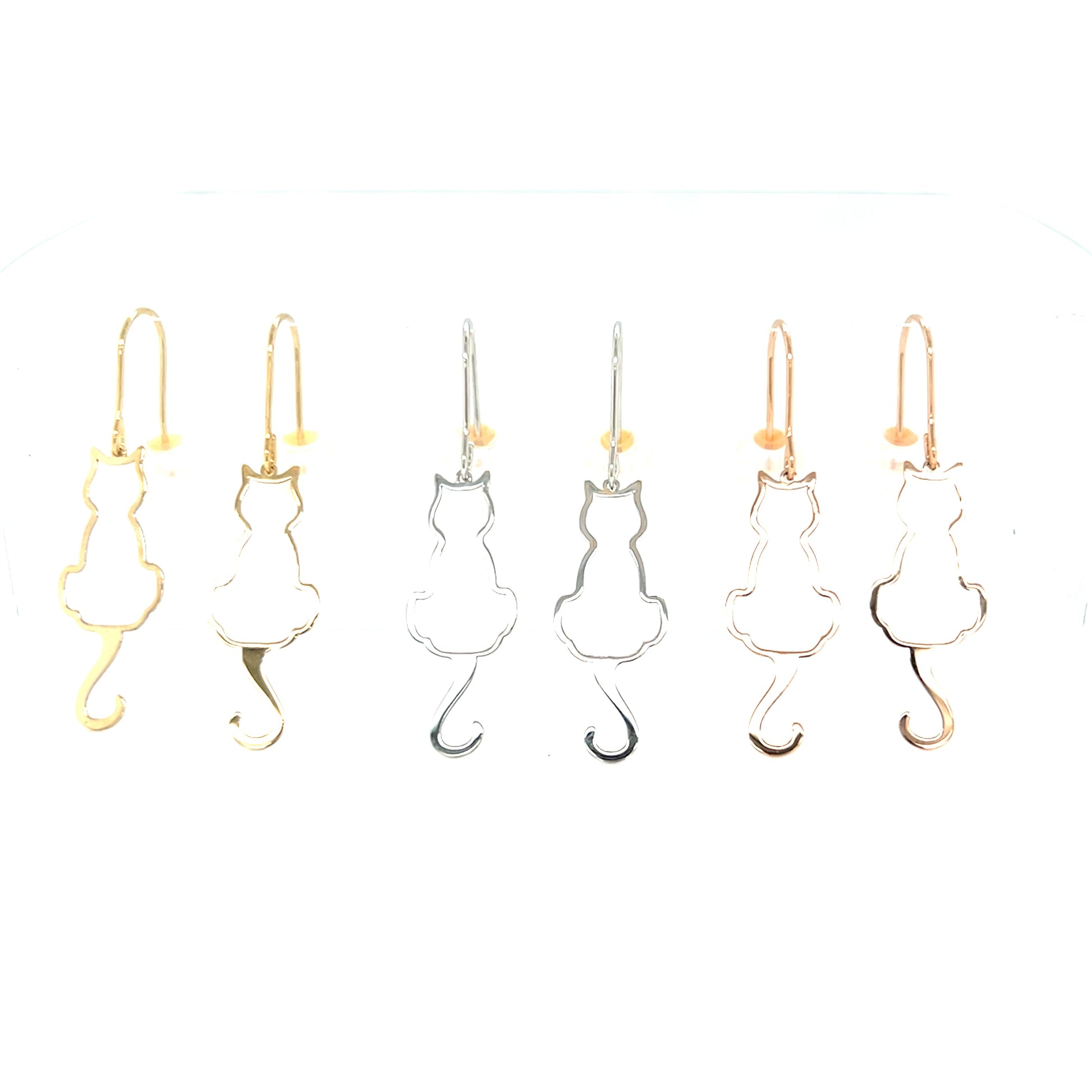 Cat-shaped drop earrings in gold and silver on a white background
