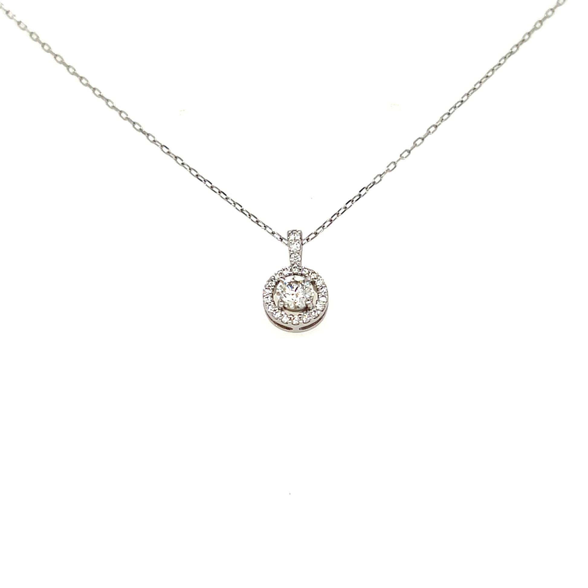 A silver-toned diamond necklace with a round halo pendant on a delicate chain, shown against a plain white background.