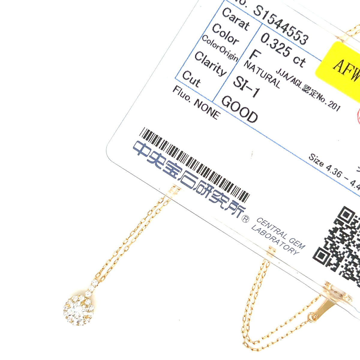 A close-up of a gold chain necklace with a teardrop-shaped clear gemstone pendant, shown alongside a detailed certification card from a gemstone laboratory.