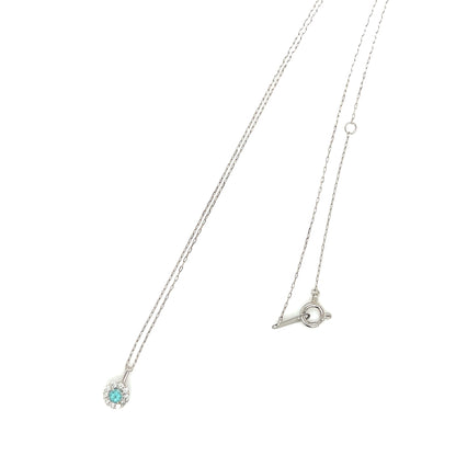 Necklace with a pendant featuring a Paraiba tourmaline gemstone on a white background