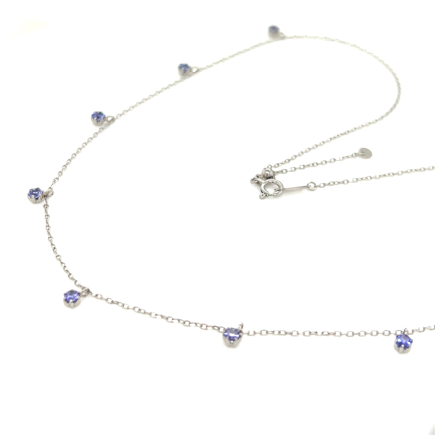 18k gold necklace with tanzanite on a white background