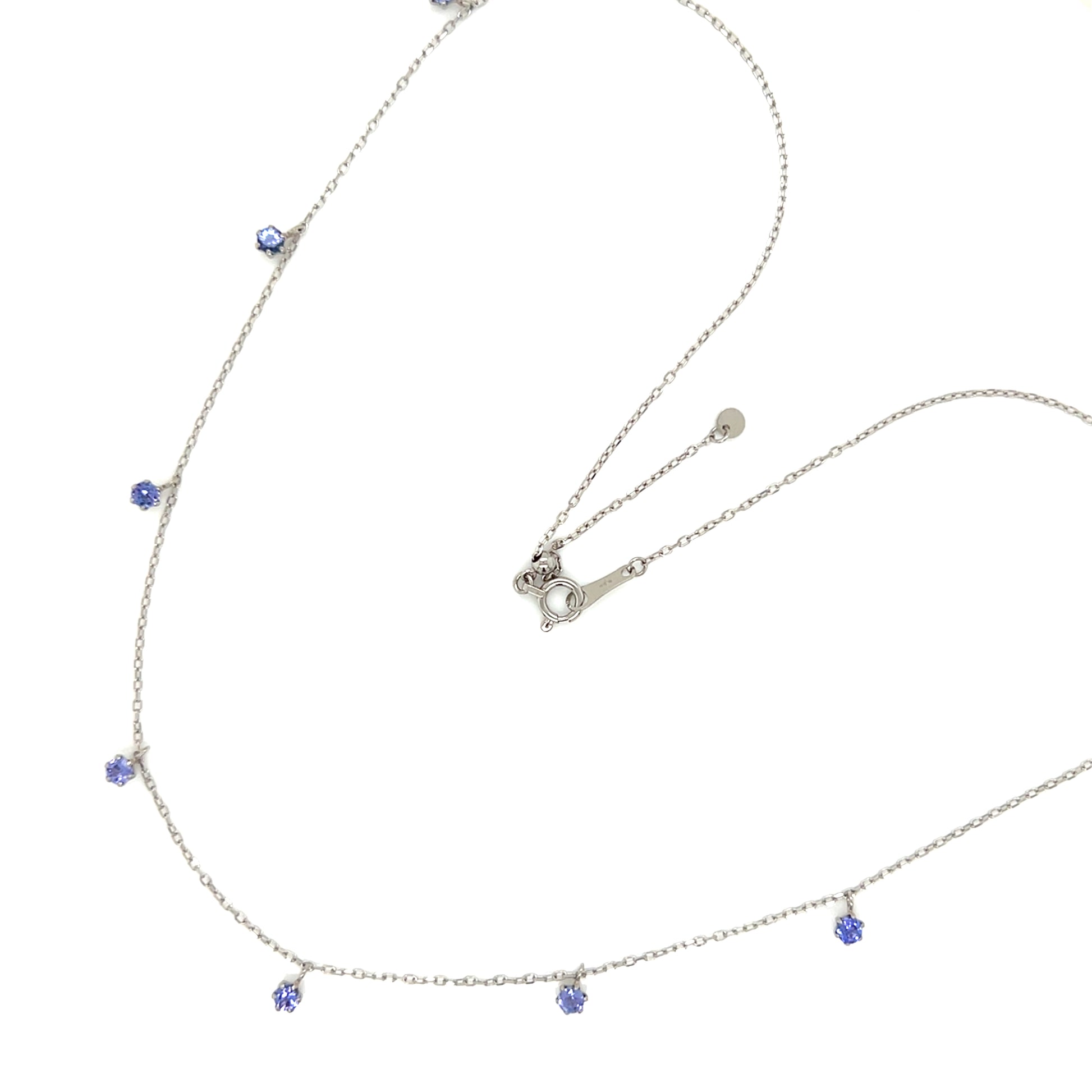 Platinum necklace with tanzanite on a white background