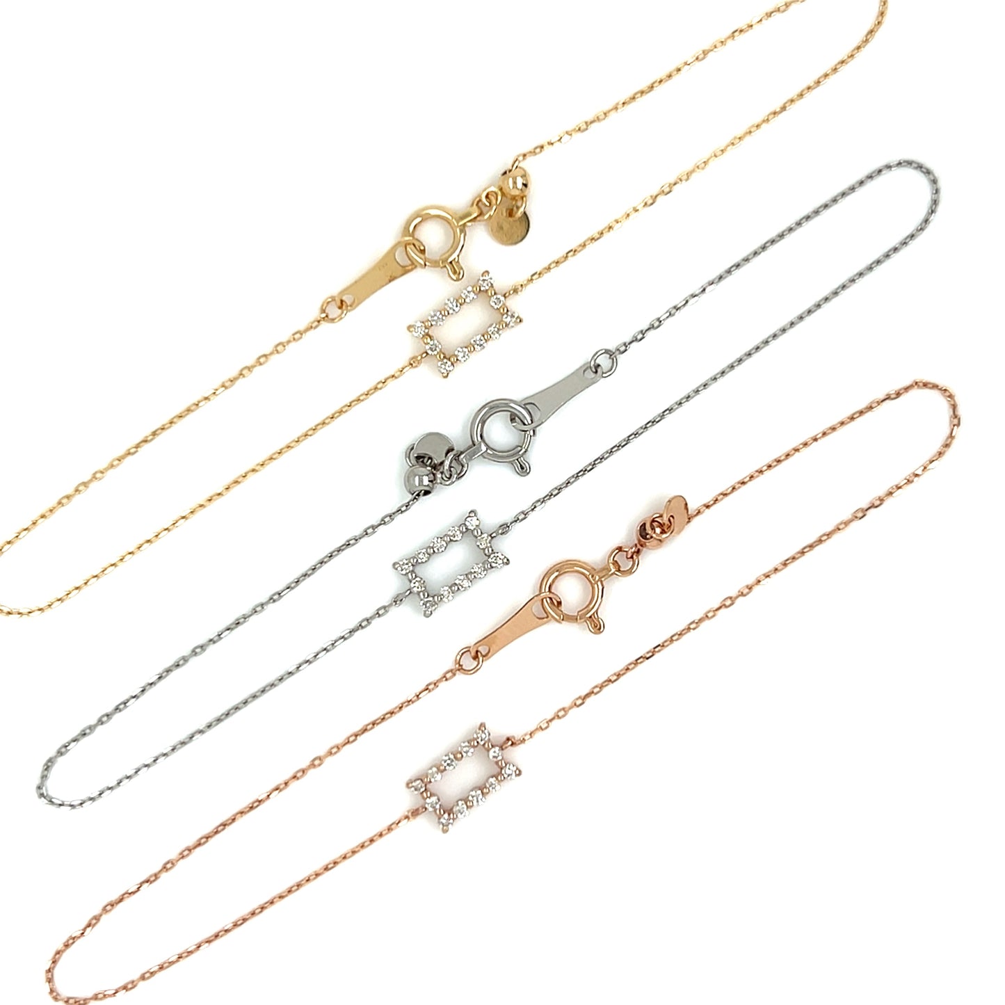 three gold chains with retangular designs on a white background