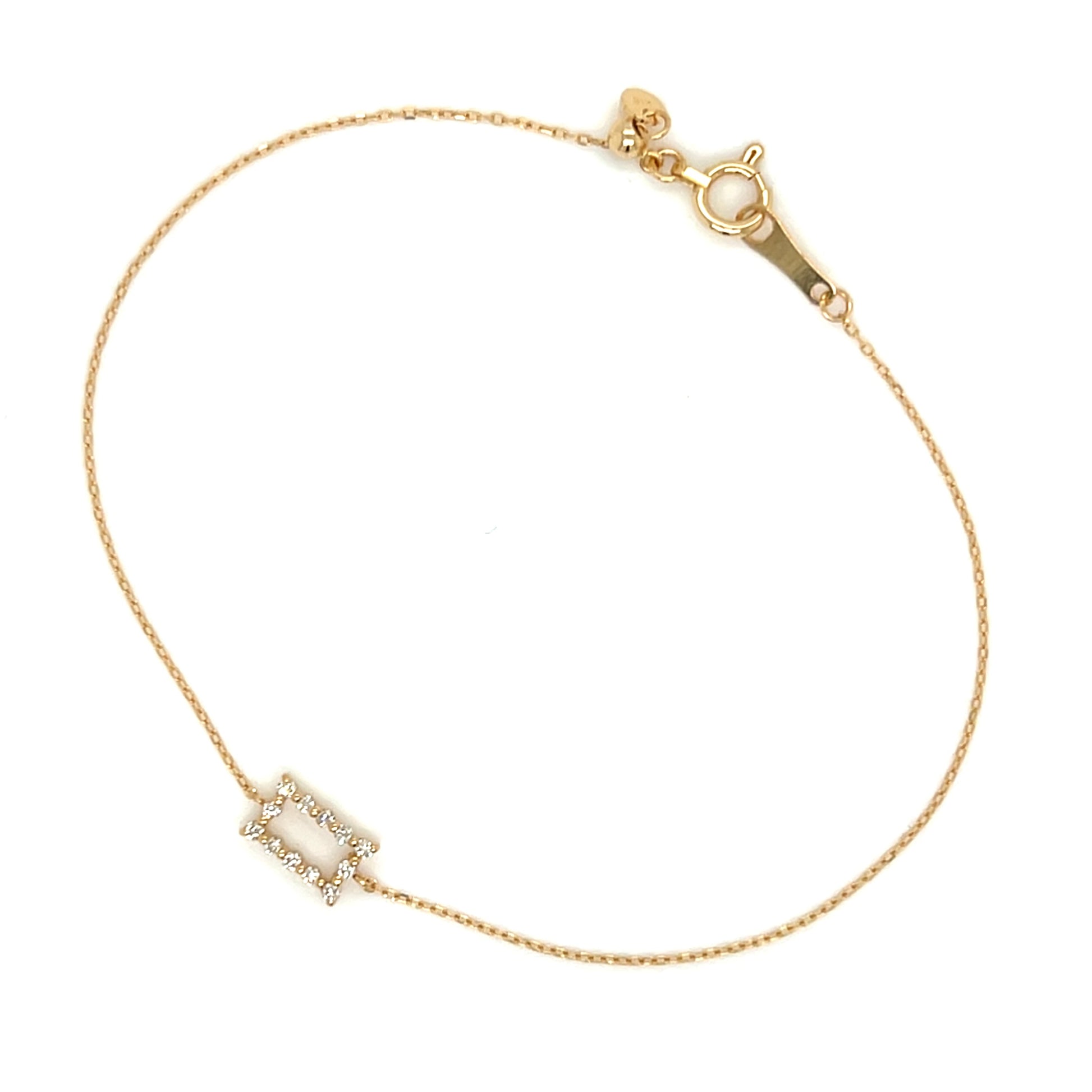 Gold bracelet with a small rectangular diamond on a white background