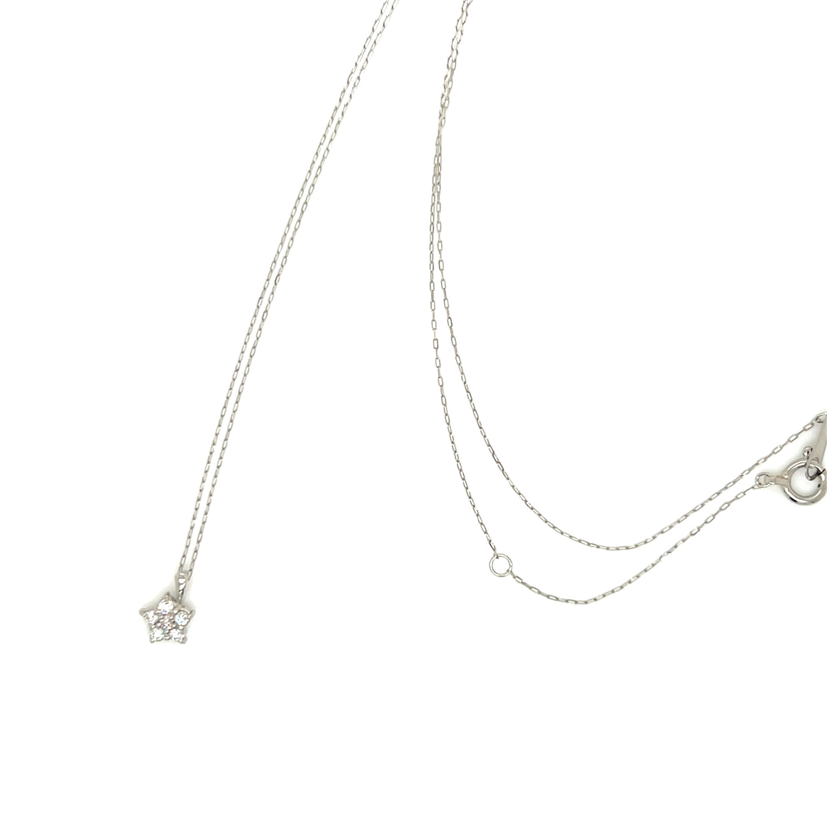 A delicate silver double-strand necklace featuring a small star-shaped pendant adorned with clear crystals, displayed against a solid white background.