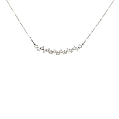 Delicate silver necklace with small diamonds on a white background