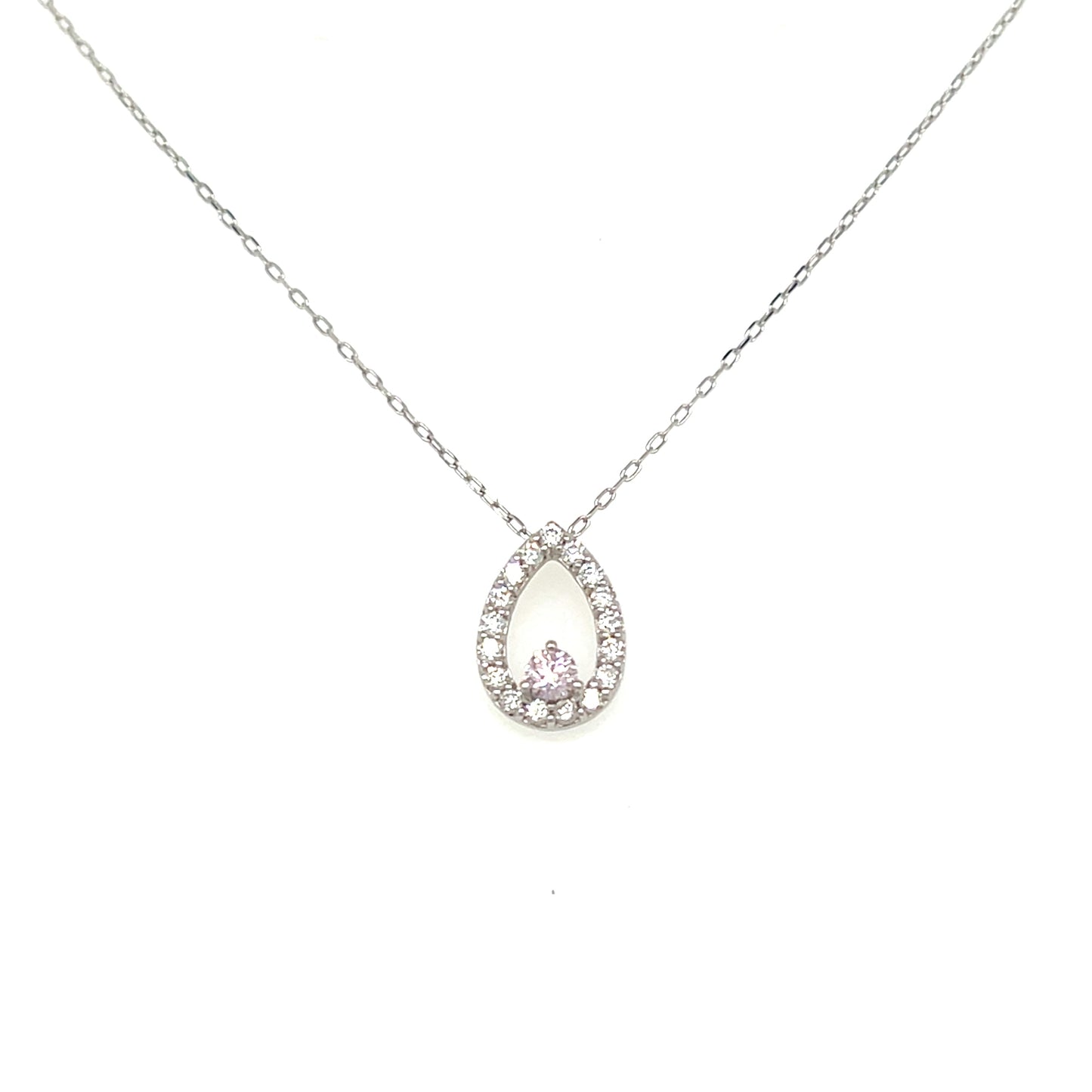 A delicate silver-toned chain necklace with a teardrop-shaped pendant. The pendant features a silver halo surrounded by small clear stones, with a central pink gemstone at the bottom, set against a plain white background.