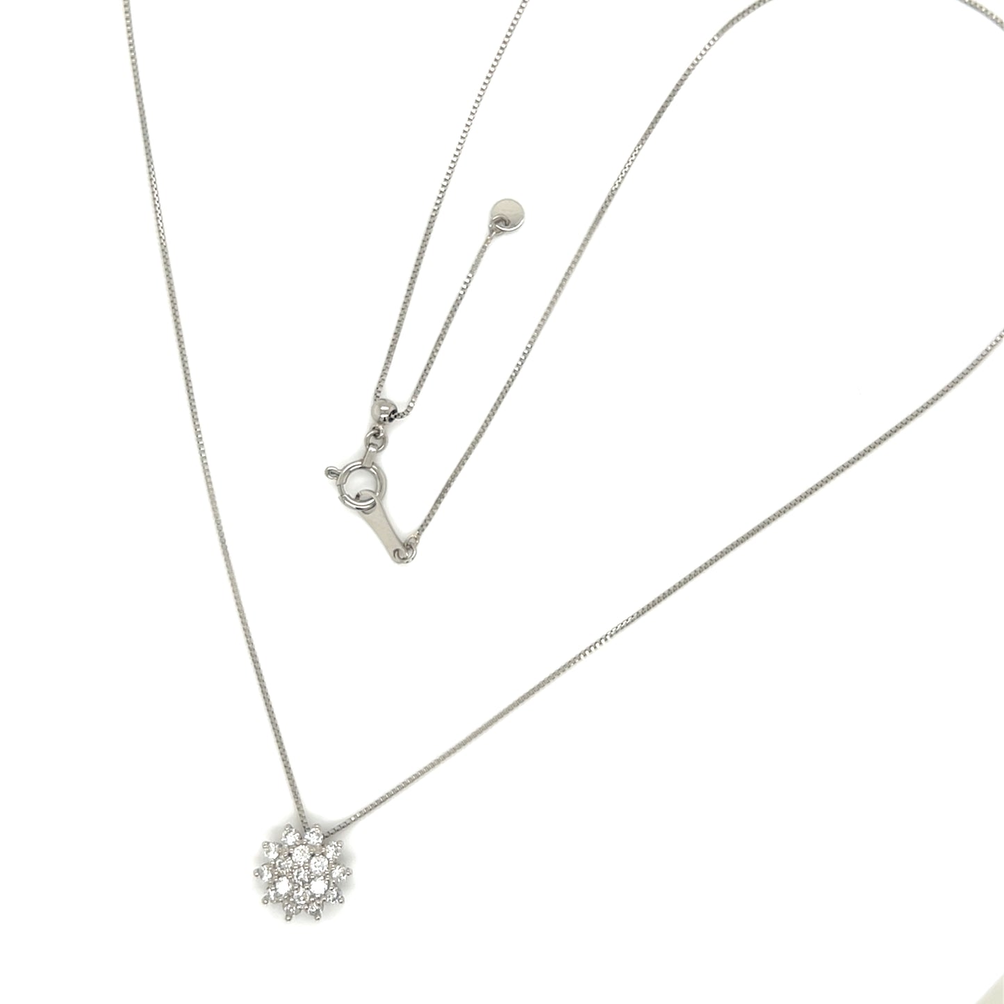 Platinum necklace with a snowflake pendant on a white background