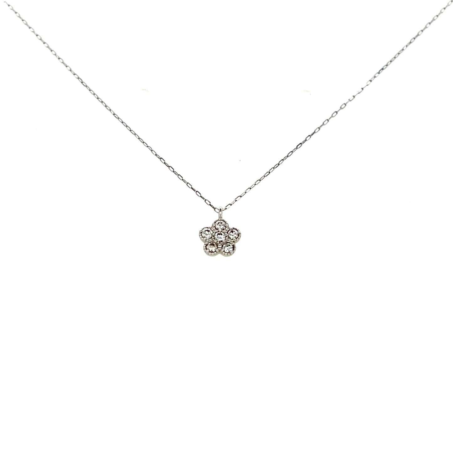 Platinum necklace with a delicate flower pendant on a white background