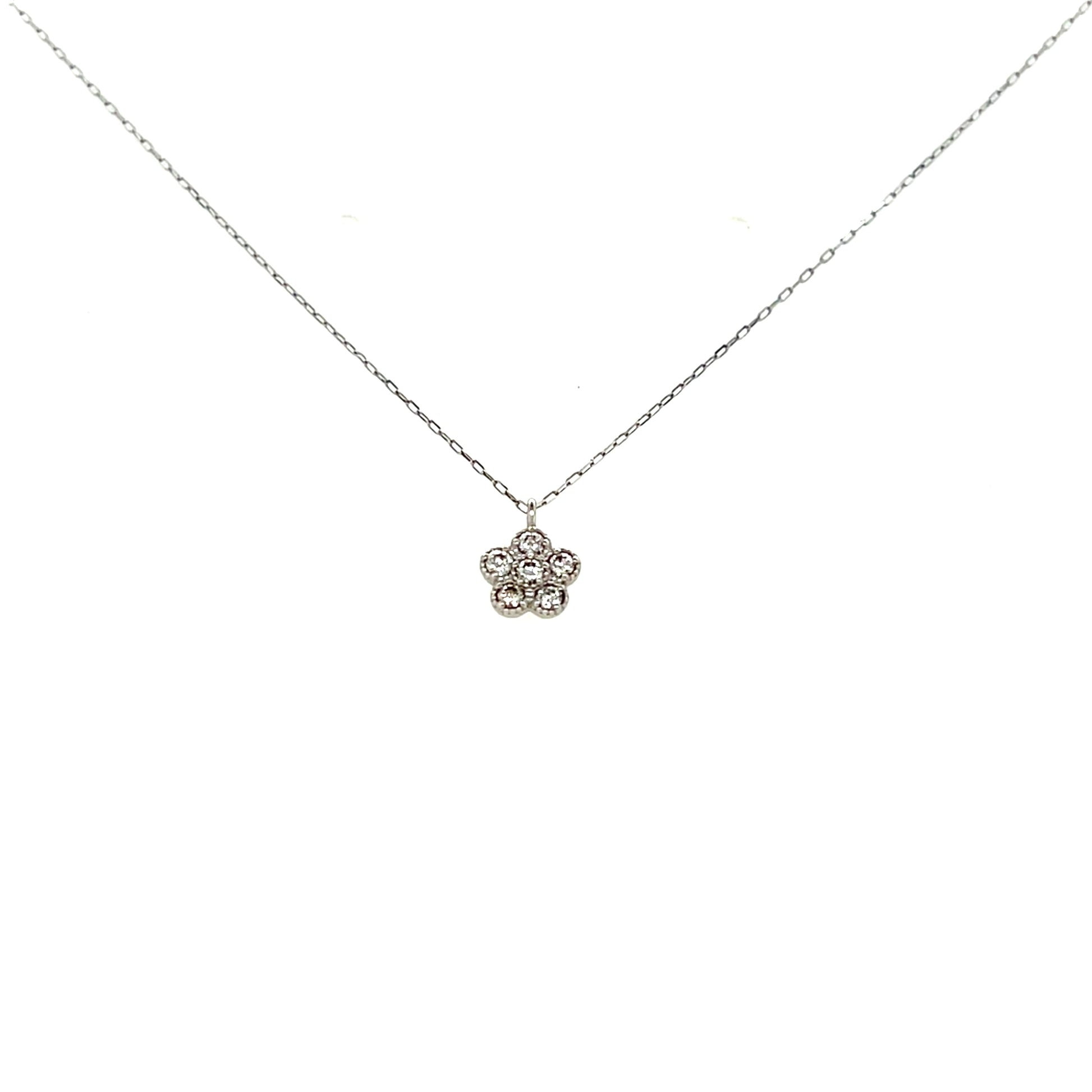 Platinum necklace with a delicate flower pendant on a white background