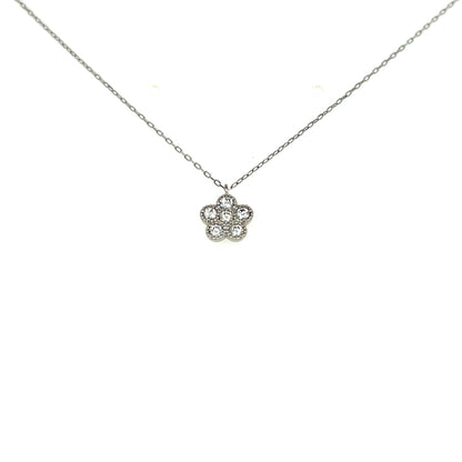 Flower-shaped silver pendant on a chain against a white background