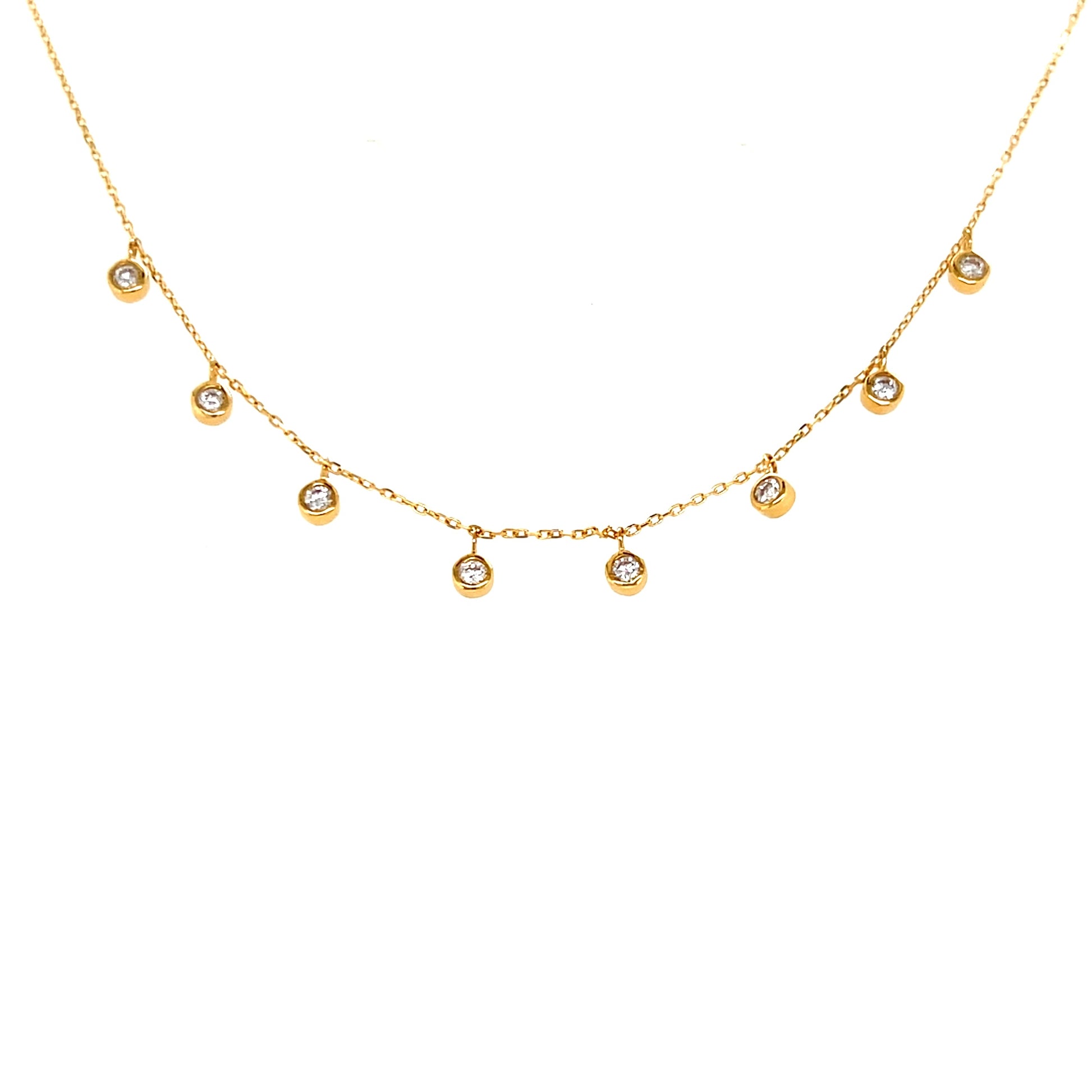 Gold necklace with small dangle diamonds on a white background