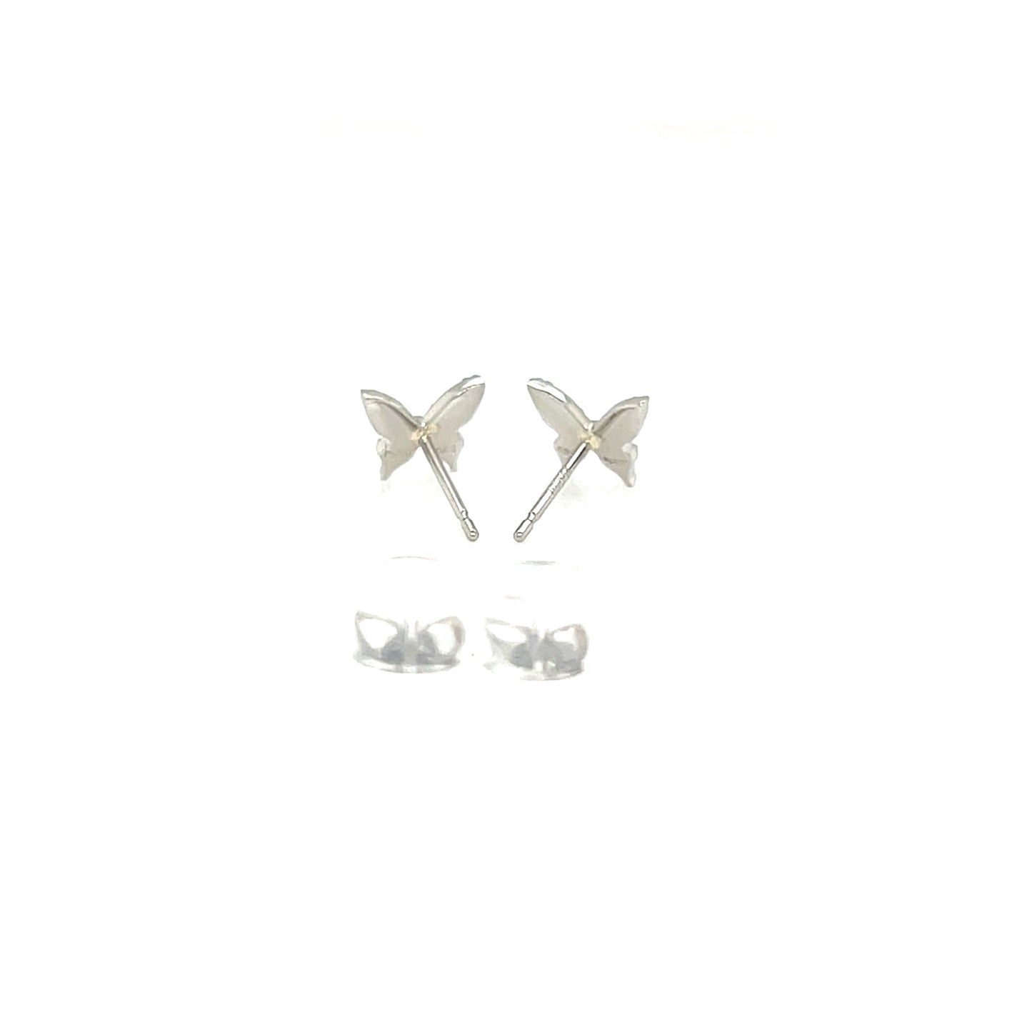 Butterfly-shaped silver earrings on a white background