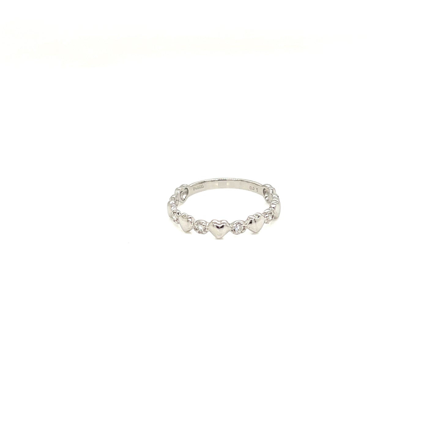 A delicate silver band ring featuring a row of small, polished heart-shaped beads, shown against a plain white background.
