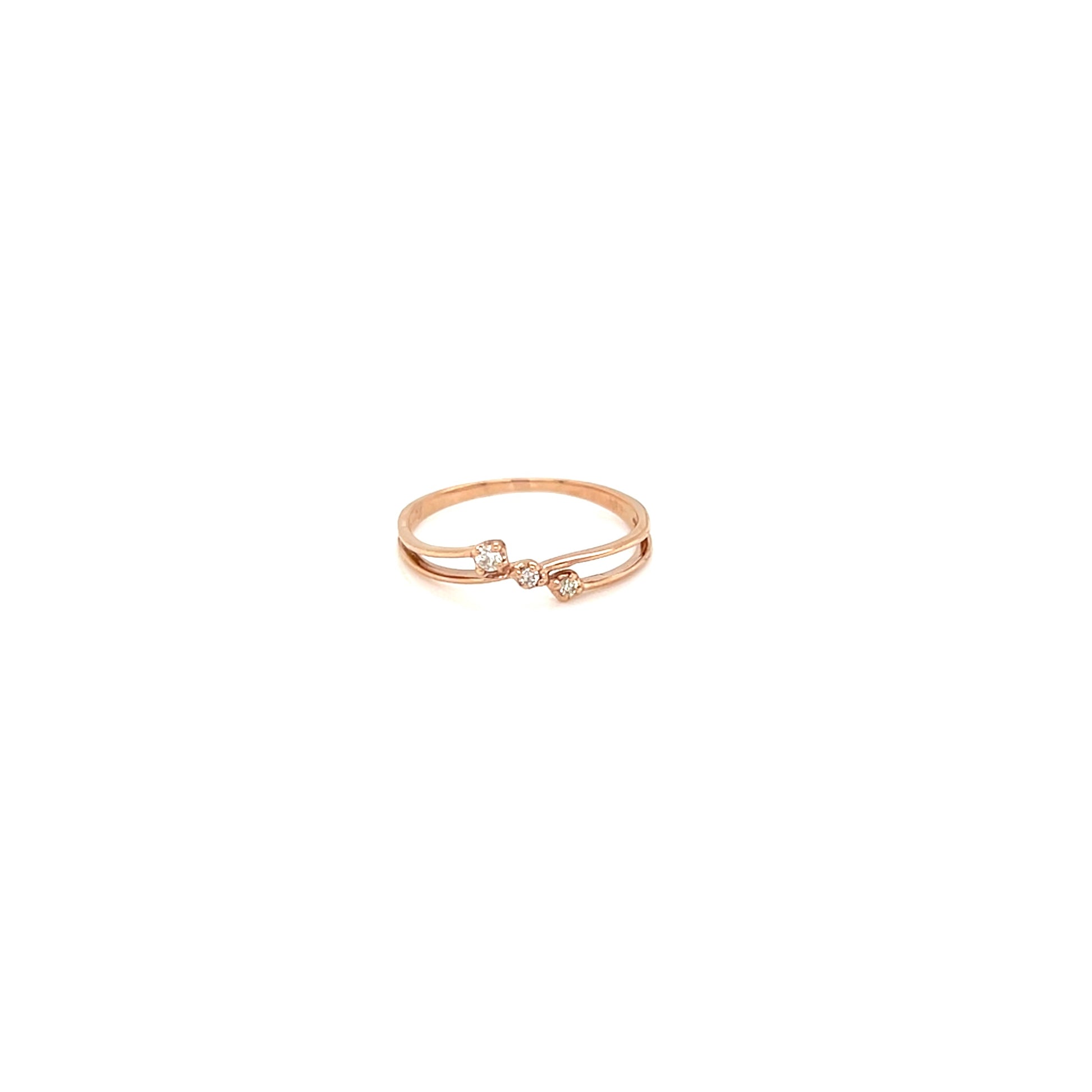 Gold ring with black stones on a white background