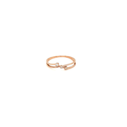 Gold ring with black stones on a white background
