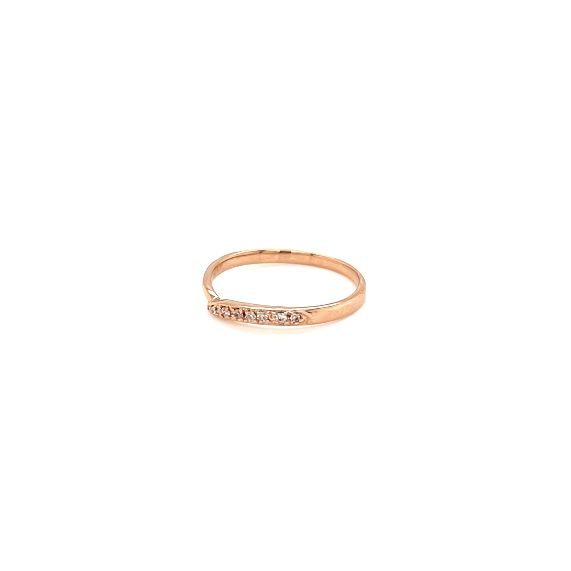 Gold ring with diamond on a white background