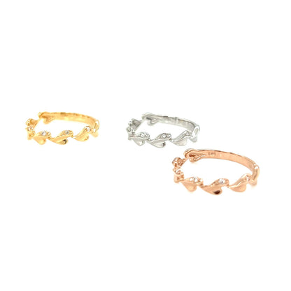 Three gold, silver, and rose gold rings on a white background