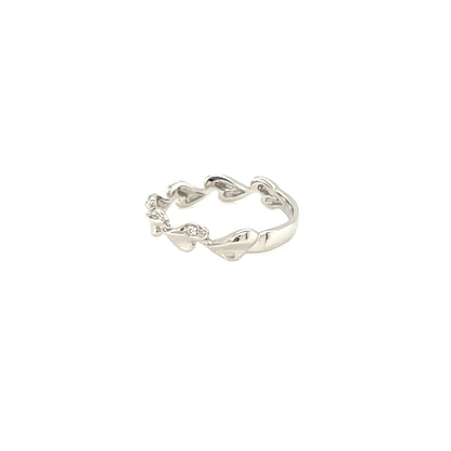 Silver ring with a heart design on a white background