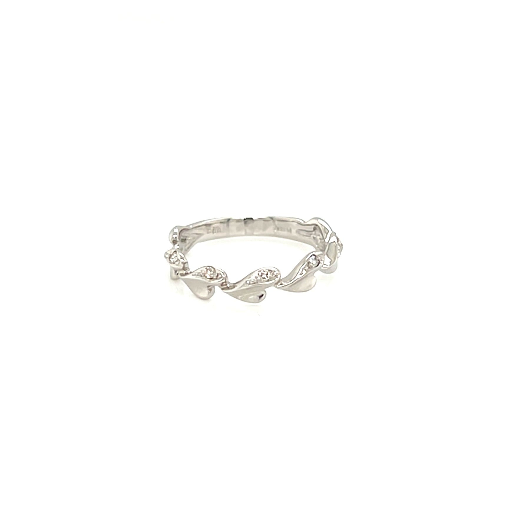Silver ring with small diamonds on a white background