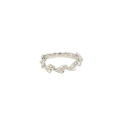 Silver ring with small diamonds on a white background