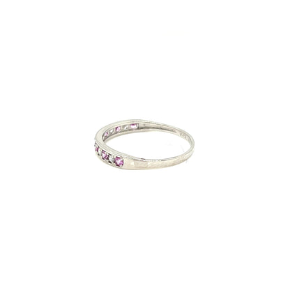 platinum ring with pink sapphire gemstones on a white background