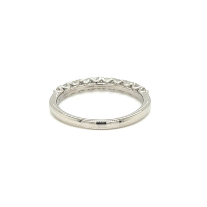 A silver eternity band ring with a row of small clear stones set around the outer edge, shown on a plain white background.