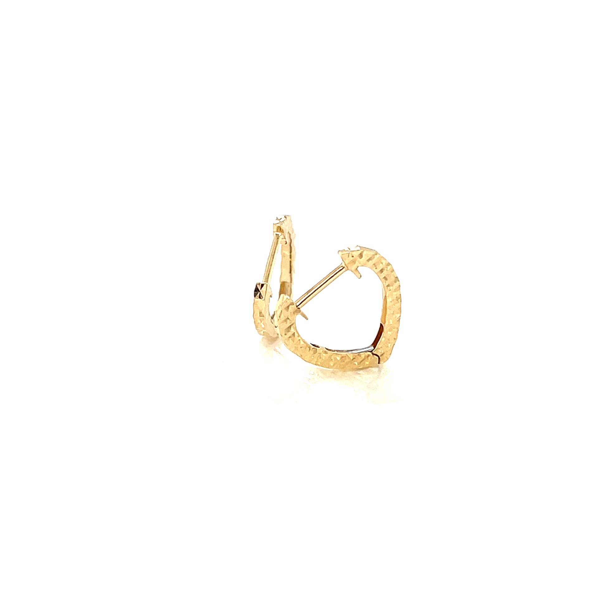 Gold hoop earring on a white background